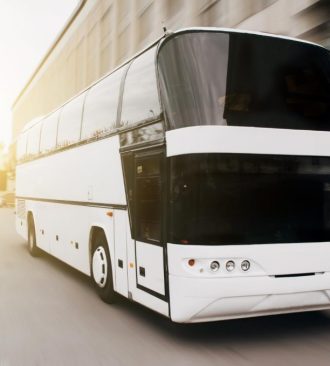 modern-tourist-bus-asphalt-evening-sunset-1024x679